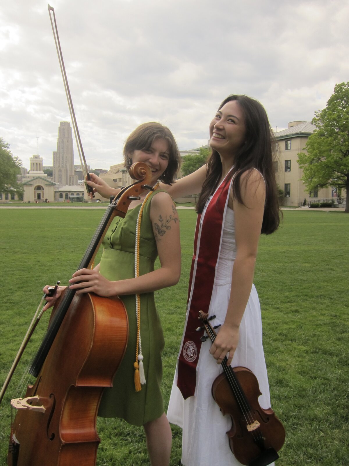 Cassandra May with a fellow musician on graduation day