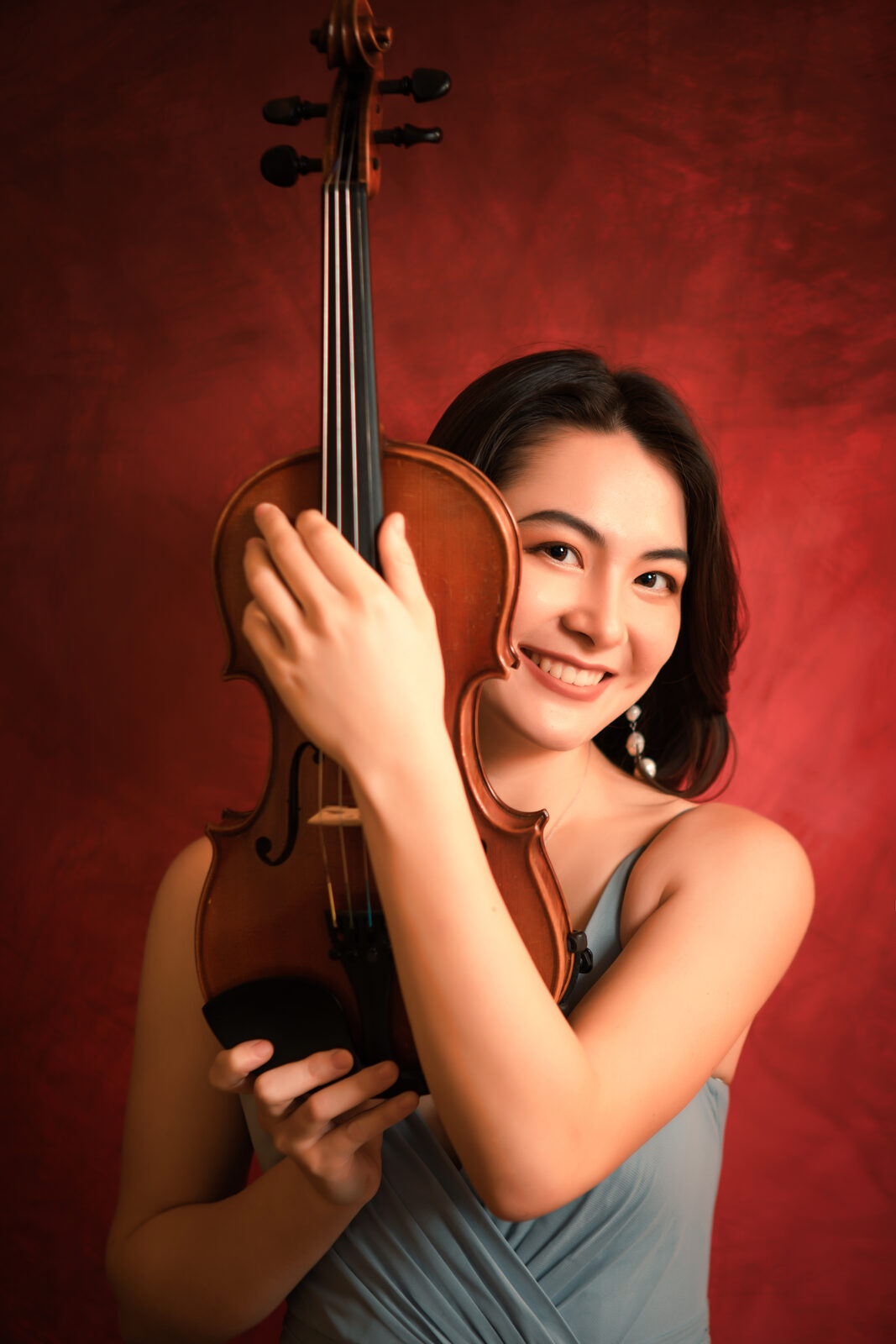 Cassandra May studio portrait with violin